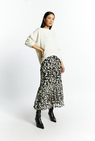 Połyskujący sweter damski