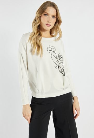 Bluza z ozdobnym kwiatem