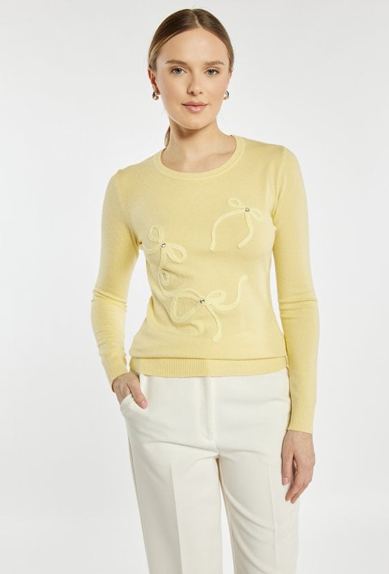 Sweter z kokardkami
