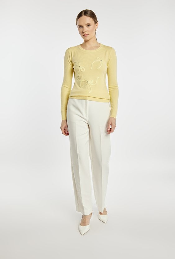 Sweter z kokardkami