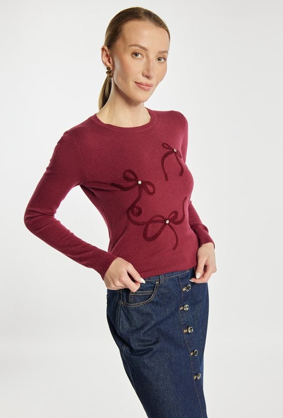 Sweter z kokardkami