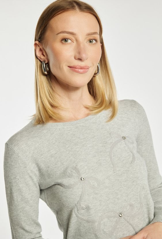 Sweter z kokardkami