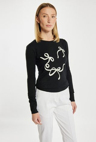 Sweter z kokardkami