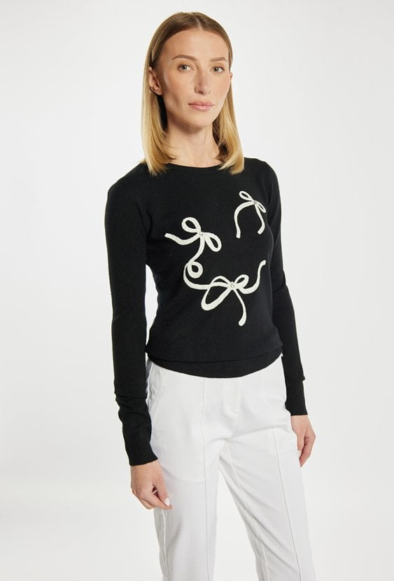 Sweter z kokardkami