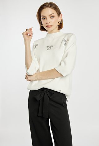 Sweter z błyszczącymi kokardkami