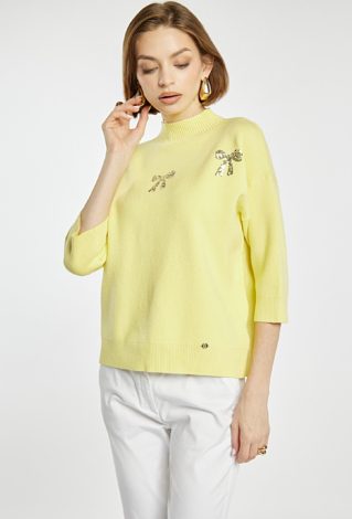 Sweter z błyszczącymi kokardkami