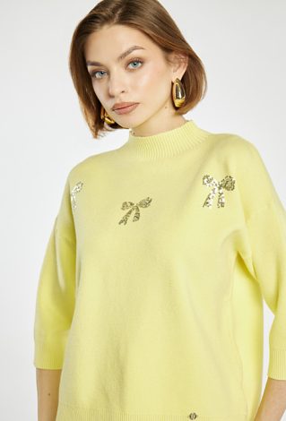 Sweter z błyszczącymi kokardkami