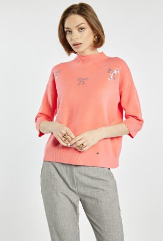 Sweter z błyszczącymi kokardkami