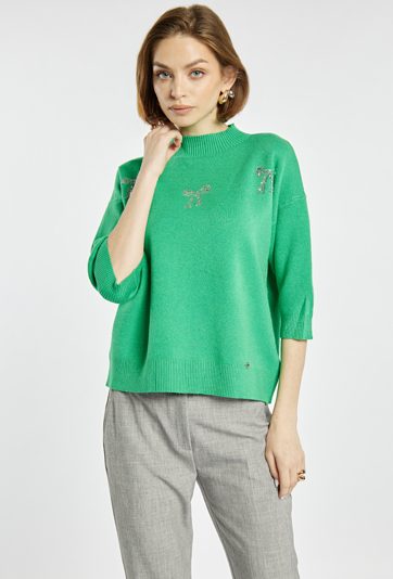 Sweter z błyszczącymi kokardkami