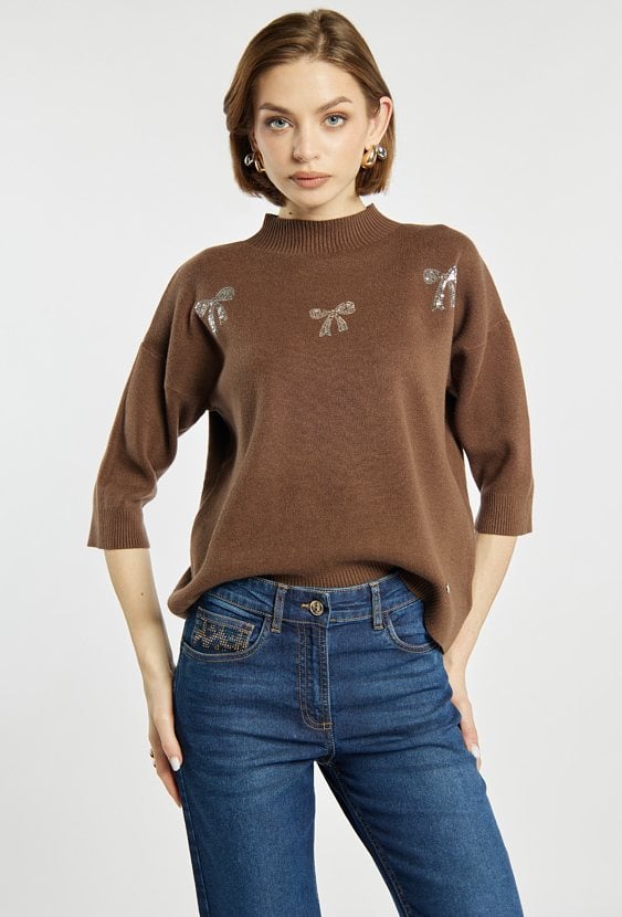 Sweter z błyszczącymi kokardkami