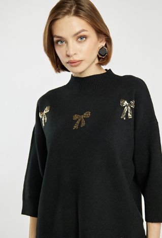 Sweter z błyszczącymi kokardkami