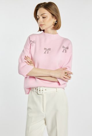 Sweter z błyszczącymi kokardkami