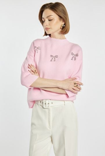 Sweter z błyszczącymi kokardkami