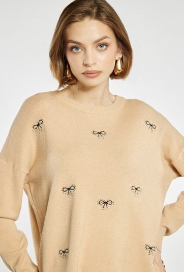 Sweter damski w kokardki