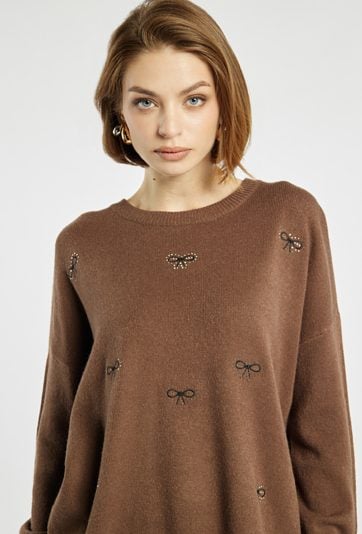 Sweter damski w kokardki