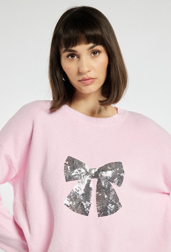 Sweter z cekinową kokardą