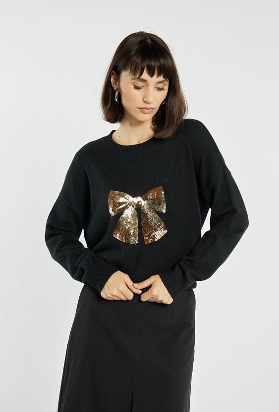 Sweter z cekinową kokardą