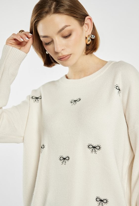 Sweter damski w kokardki