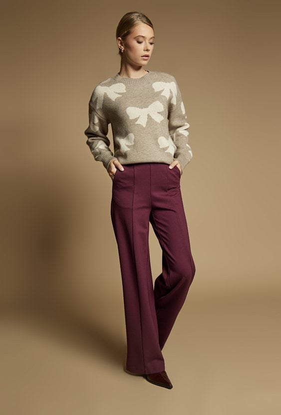 Sweter damski z kokardkami