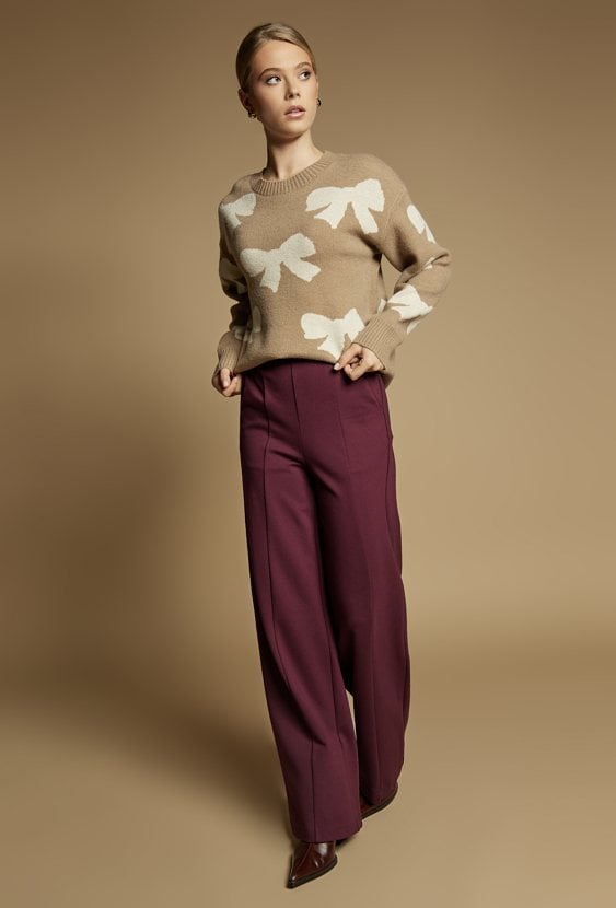 Sweter damski z kokardkami